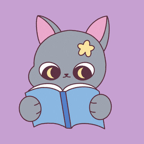 Un chat lit un livre.