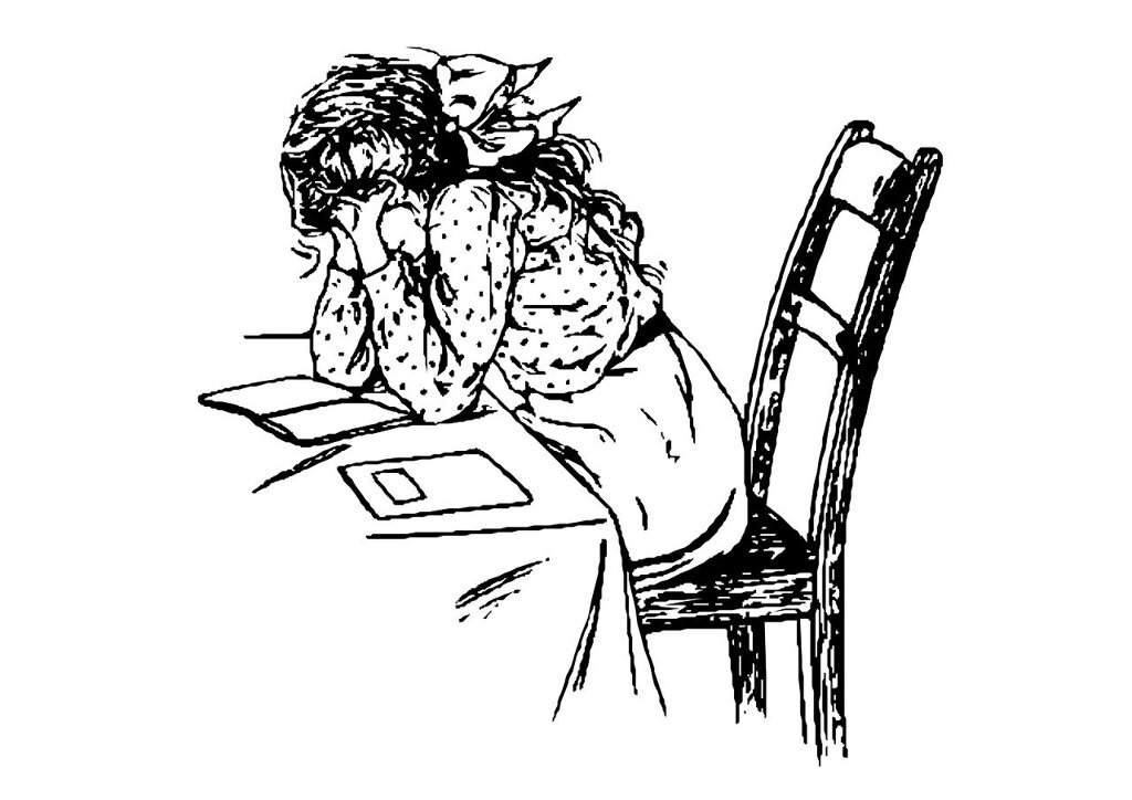 Elève qui pleure à son bureau